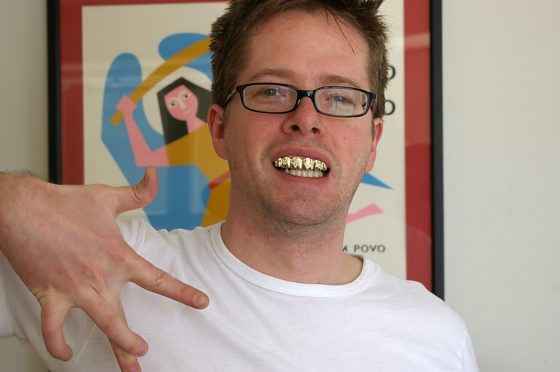 a guy wearing grillz